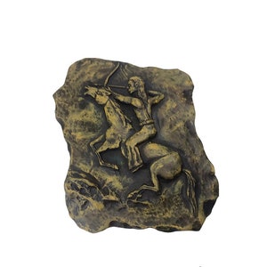 Indian warrior plaque  of an Indian rider with a bow and arrow