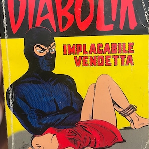 May include: Vintage Italian comic book cover featuring a masked figure and a woman in a red dress. The title "Diabolik" is in large red letters, with the words "Implacable Vendetta" below. The comic has a retro style.