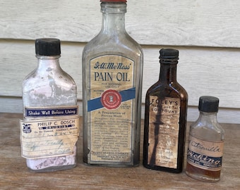 4 Antique apothecary bottles feature original labels from the early 20th century