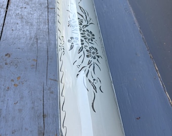 Vintage U-shaped channel glass shade from a Mid-Century Modern bathroom vanity