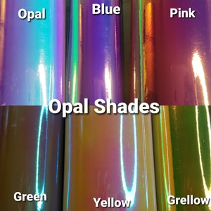 Op de afbeelding: Een verzameling iriserende vinylrollen in verschillende kleuren, waaronder opaal, blauw, roze, groen, geel en grellow. De tekst "Opal Shades" staat in het wit afgebeeld. Elke rol heeft een glanzende afwerking.