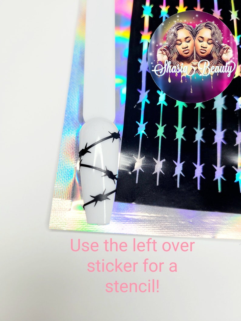 Puede incluir: Una hoja de pegatinas para u&ntilde;as negras y blancas con un dise&ntilde;o de alambre de p&uacute;as. Las pegatinas est&aacute;n sobre un fondo hologr&aacute;fico. El texto "Shasia Beauty" es visible en una pegatina en la esquina superior derecha. El texto "Use the left over sticker for a stencil!" es visible en rosa en la parte inferior de la imagen.