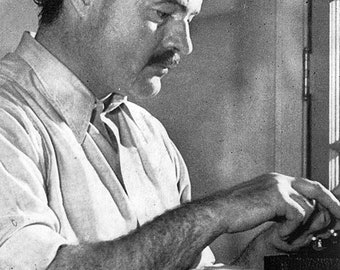 Poster, Many Sizes Available; Ernest Hemingway working on his book For Whom the Bell Tolls