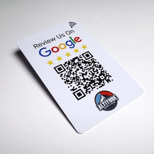 May include: A white rectangular card featuring the text Review Us On Google, a Wi-Fi symbol, five yellow stars, a black and white QR code, and a circular logo for Altitude Heating & Cooling with a mountain graphic in red, blue, and white colors.