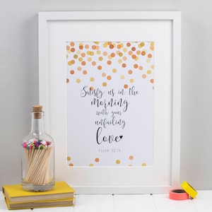 May include: White framed print with a gold confetti background and the text "Satisfy us in the morning with your unfailing love" with a small heart symbol and "Psalm 90:14" below.