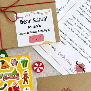 close up of the Smallkind personalised letter to santa christmas activity kit including a gift box, personalised letter from santa and christmas stickers
