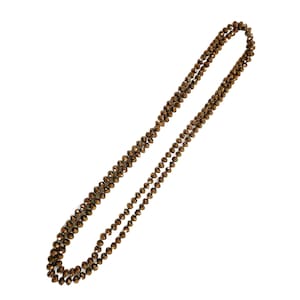 May include: A long, layered necklace featuring small, faceted beads in shades of brown and gold. The beads are strung together to create a delicate, yet eye-catching accessory. The necklace is displayed against a white background.