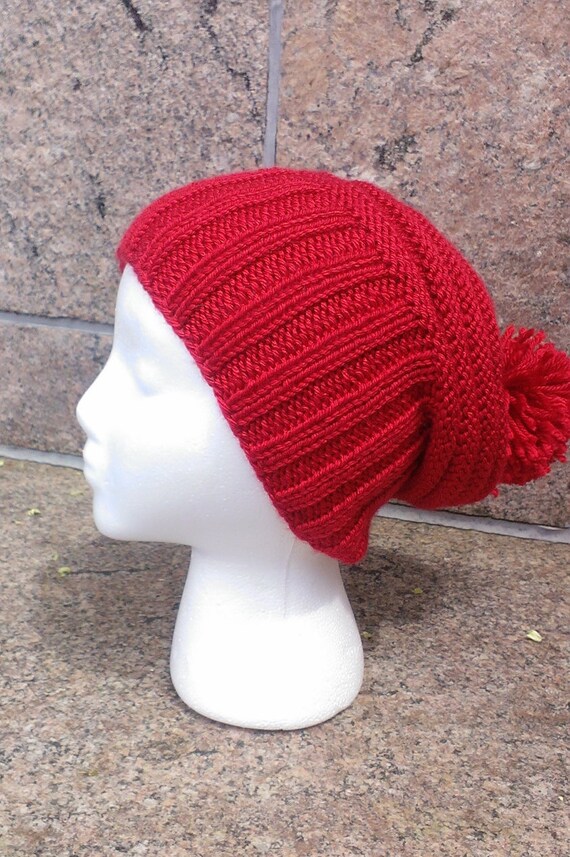 red winter hat with pom pom