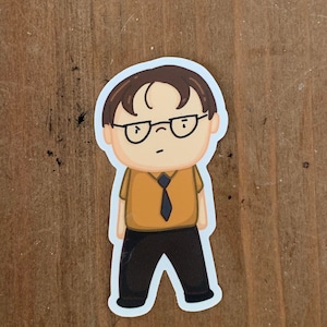 May include: A cartoon sticker of a character wearing a yellow shirt, black pants, and glasses. The character has brown hair and a serious expression.