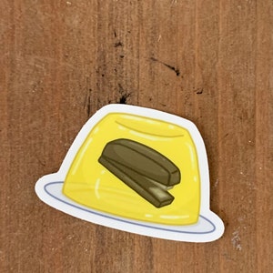 The Office Mini Stapler Jello Sticker - The Office matte finish die cut cartoon laptop sticker of the Stapler in Jello prank