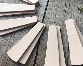 Örhängen i läder, 12 delar, 6,5 cm höga stänger