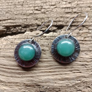Sterling silver and aventurine cabochon dangly earrings.