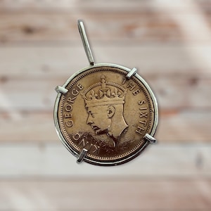 Silver coin pendant.