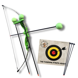 May include: A green and camouflage patterned toy bow with two light green foam balls attached to the riser. One arrow with a light green foam ball tip is included, along with three additional arrows and a square target with a bullseye.