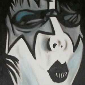 May include: A black and white painting of a person's face with a star-shaped design on the forehead. The person is wearing black eyeliner and has a black mouth.