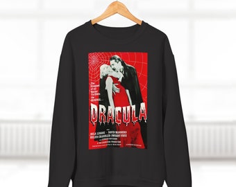 Könnte beinhalten: Schwarzes Sweatshirt mit einem roten und weißen Grafikdruck des klassischen Horrorfilm-Posters für Dracula. Das Poster zeigt ein Schwarzweißbild von Bela Lugosi als Dracula und Helen Chandler als Mina Harker. Der Text auf dem Poster lautet "The Greatest of all Horror Thrillers...The Original...Dracula".
