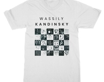 May include: White t-shirt with a black and white graphic design of abstract shapes and the text "Wassily Kandinsky" printed on the front.