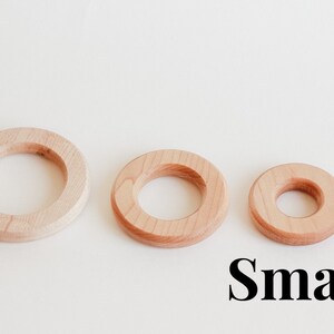 May include: Three wooden rings of different sizes, with the smallest ring labelled "Small".