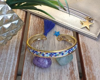 Fine golden brass bangle bracelet with miyuki beads adorned with royal blue, white, lagoon green and gold beads