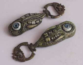 Bottle opener Lovecraftian Victorian monster with teeth