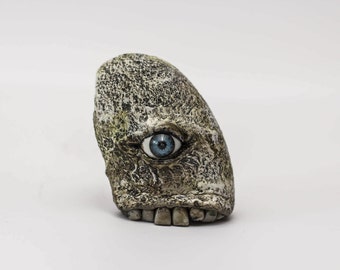 Spooquish rock monsters creepy sculpture with eyes and teeth