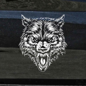 May include: A black and white illustration of a wolf's head with a snarling expression. The wolf's teeth are bared and its eyes are narrowed.