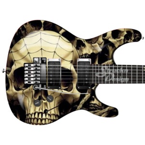 May include: A black electric guitar with a skull and spiderweb design. The guitar has a white skull with a spiderweb on the body and a black neck and fretboard.