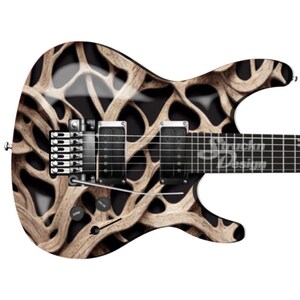 May include: A black electric guitar with a brown and white antler design. The guitar has a black body and a black neck with silver tuning pegs. The guitar has two black pickups and a black bridge.