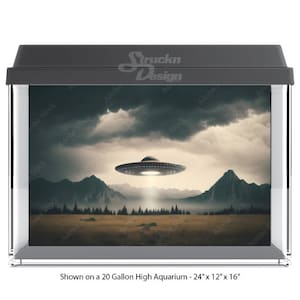 May include: A 20-gallon high aquarium with a black frame and a printed background image of a UFO flying over a mountain range. The image is shown on a 24" x 12" x 16" aquarium.