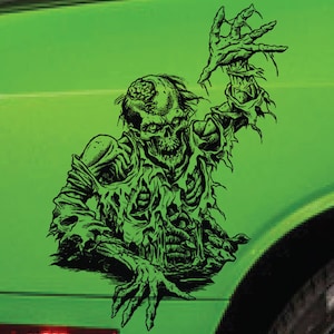 May include: Black and white illustration of a zombie with exposed bones and a ripped shirt, reaching out with one arm. The zombie is on a green background.
