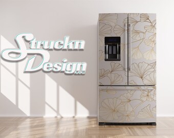 May include: A white refrigerator with a gold and white ginkgo leaf design. The refrigerator has a double door and a water dispenser. The text "Struckn Design LLC" is visible on the wall behind the refrigerator.