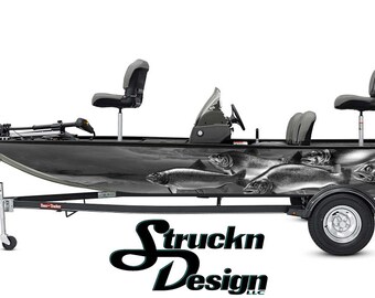 May include: A black fishing boat with a grey and white fish pattern on the side. The boat is on a trailer with a black frame and wheels. The boat has a Mercury outboard motor and three seats.