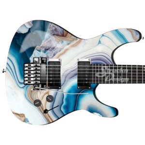 May include: A blue and white electric guitar with an agate pattern. The guitar has a black body and a silver pickguard.
