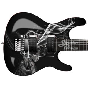 May include: Black electric guitar with a white smoke design. The guitar has a black body and a white pickguard. The smoke design is on the body and the neck of the guitar.