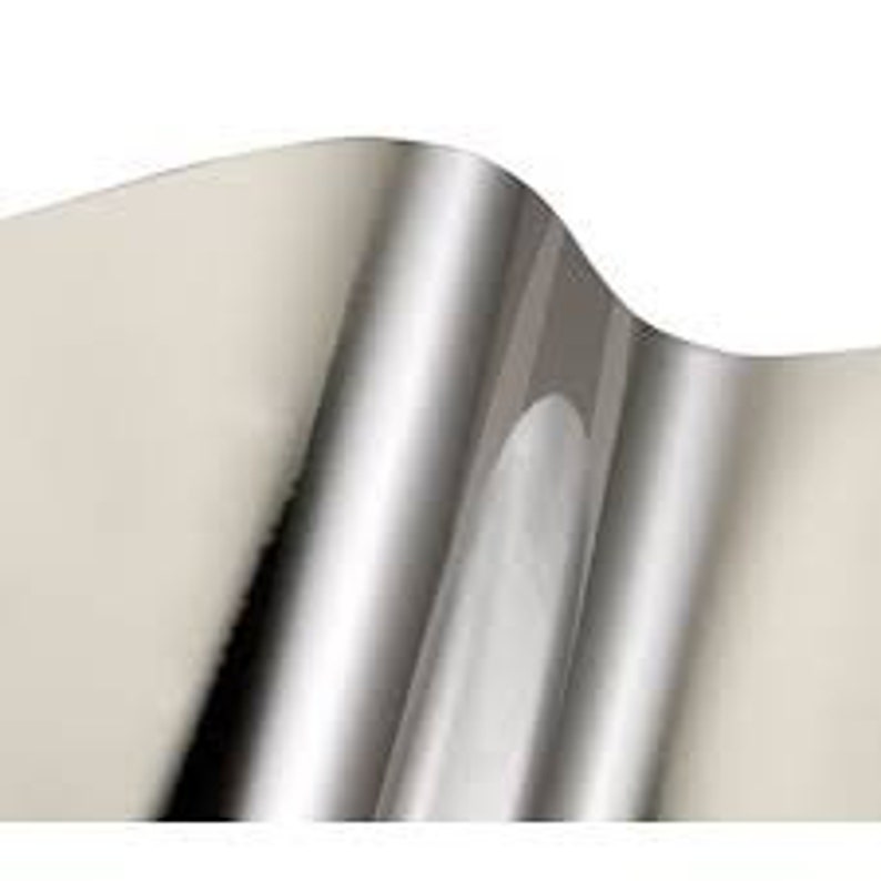 May include: A roll of silver adhesive vinyl with a glossy finish.