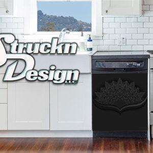May include: Black dishwasher with a white mandala design on the front. The dishwasher is in a kitchen with white cabinets and a white tiled backsplash.