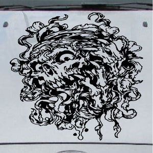 May include: Black and white graphic design of a skull with swirling tendrils. The skull is detailed with intricate lines and shading.