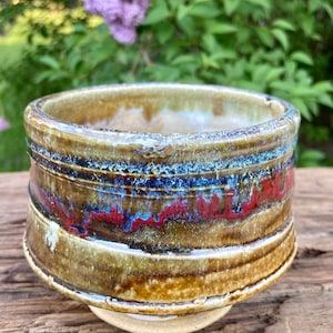 Pottery bowl stoneware clay thrown, trimmed on the wheel wearing 6 color glazes thrice fired over a 42 year period never sold or used