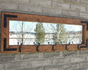 Entryway rustic industrial mirror coat rack with oil rubbed bronze hooks.