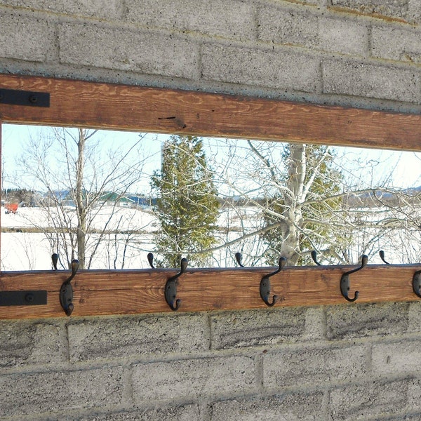 Entryway rustic industrial mirror coat rack with oil rubbed bronze hooks.