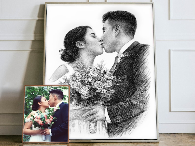 May include: A black and white pencil drawing of a couple kissing. The woman is holding a bouquet of flowers. The drawing is framed in a silver frame.