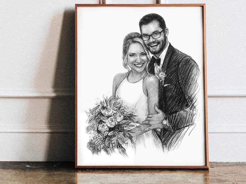 May include: A black and white pencil drawing of a couple in formal attire. The woman is wearing a white dress and holding a bouquet of flowers. The man is wearing a suit and tie. The drawing is framed in a wooden frame.