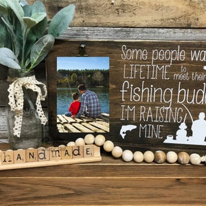 Some people wait a lifetime to meet their fishing buddy/buddies, I&#39;m raising mine Picture Frame | Fathers Day Gift