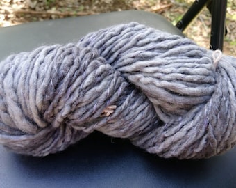 Handspun and hand dyed yarn, pure Australian Merino wool. Shades of grey and wisteria purple. 130 grams approx. 12 ply. By Soft Senses Yarn