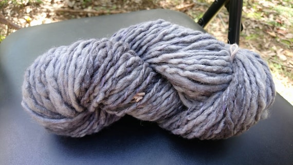 Handspun and hand dyed yarn, pure Australian Merino wool. Shades of grey and wisteria purple. 130 grams approx. 12 ply. By Soft Senses Yarn