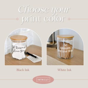 May include: Two glass jars with wooden lids, labeled "50 Reasons I Love You" and "50 Reasons We Love You." The text is available in black or white ink. The jars are displayed on a light-colored surface.