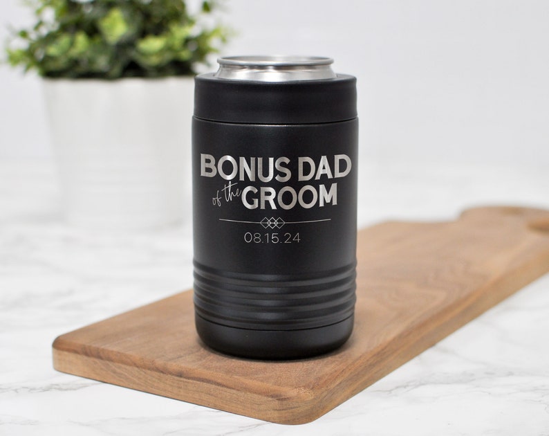 May include: Black stainless steel can cooler with the text "Bonus Dad of the Groom" and the date "08.15.24" engraved on it.