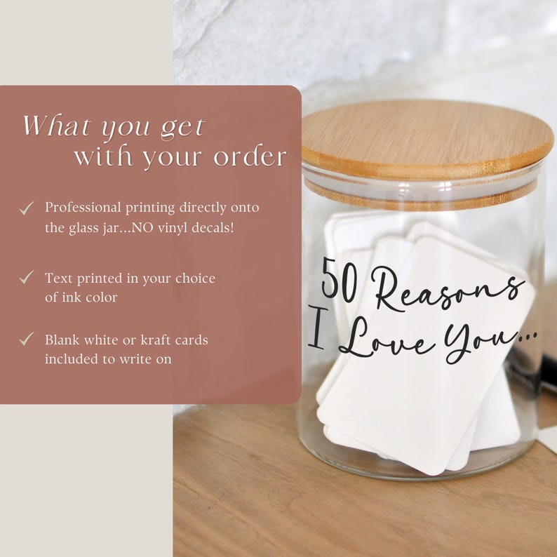 May include: A clear glass jar with a wooden lid, filled with white cards. The text "50 Reasons I Love You..." is written on the cards. A sign on the left says "What you get with your order".