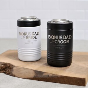 May include: Two stainless steel can coolers, one white and one black, with the text "Bonus Dad of the Bride" and "Bonus Dad of the Groom" and the date "08.15.24" engraved on them.