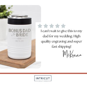 May include: White insulated can cooler with a black lid. The cooler has the text "BONUS DAD of the BRIDE" and the date "08.15.24" engraved on it.